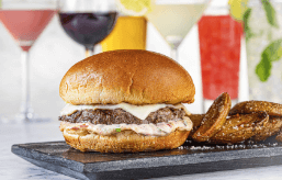 An image of Brio's burger for happy hour