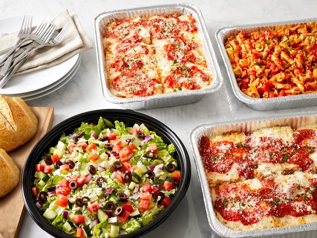 Brio Italian Catering Tour Groups catering spread of pasta, lasagna, chopped salad and bread