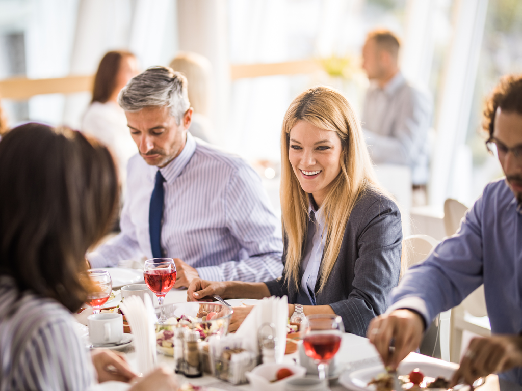 Brio Italian Restaurant Corporate Event people at a table with wine and food