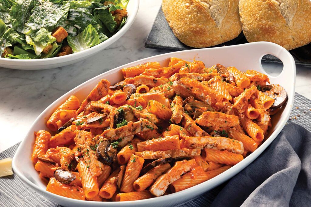 An image of Pasta Brio with caesar salad and bread