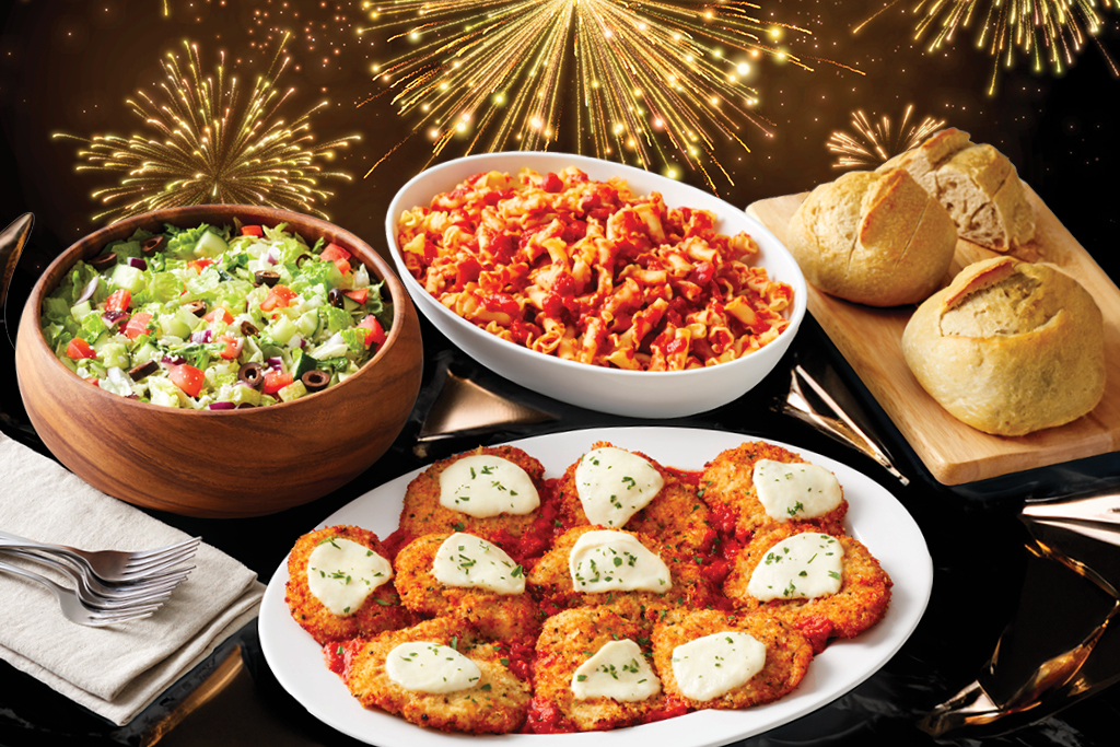 Brio Italian New Years Fireworks background witch chopped salad, pasta, chicken parmesan, and bread